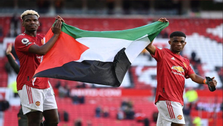 Paul Pogba holds Palestine flag