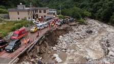 China Evacuates 81,000, Searches for Mudslide Victims