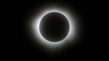 Total solar eclipse begins, darkening daytime sky