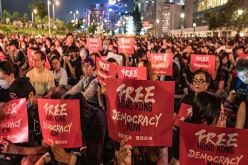 Hong Kong protest: police arrest 36, fire tear shells