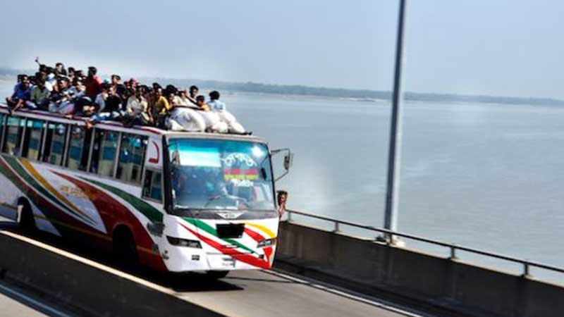 Photo: A public bus carrying people more than its capacity.
