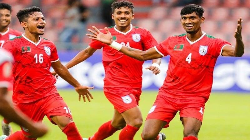Bangladesh football team players pose after wining over Sri Lanka