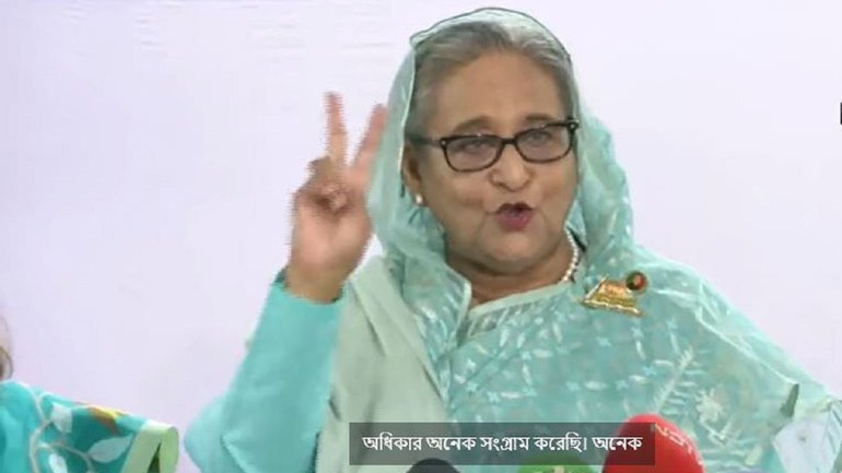 PM Sheikh Hasina shows 'V' sign after casting her vote.
